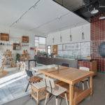 H2R Design uses textured painted walls and wooden furniture for cafe Brew